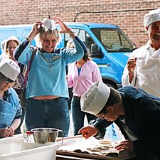 Photo: visitors decorate rolls and try on hats