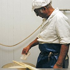 Photo: adding nigari coagulant