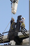 Photo: fitting a sail to Whissendine Windmill (9kB)